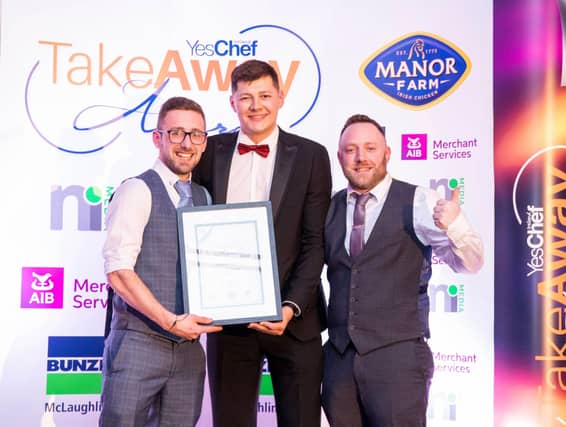 Fire & Stone duty managers Chris and Dan pictured receiving the Pizza of the Year Award.