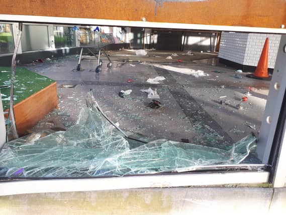A shopping trolley appears to have been hurled through the window at the old tourist office in Arthur's Quay