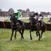 Darasso and Mark Walsh (left) begin to get on top in the closing stages of the BetVictor Limestone Lad Hurdle
