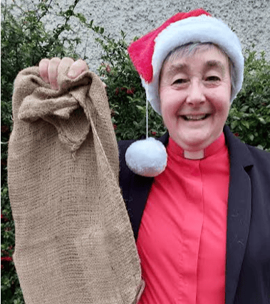 Rev Fran Grasham has hung up a sandbag Christmas stocking to focus on the hunger crisis in South Sudan
