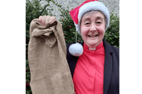 Rev Fran Grasham has hung up a sandbag Christmas stocking to focus on the hunger crisis in South Sudan
