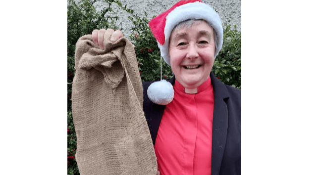 Rev Fran Grasham has hung up a sandbag Christmas stocking to focus on the hunger crisis in South Sudan