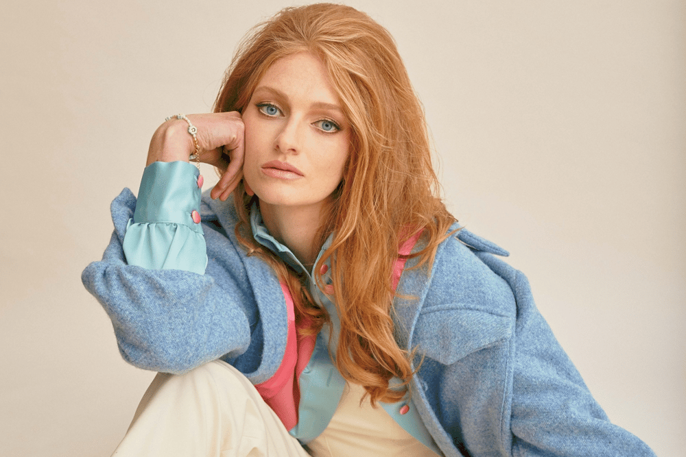 This high collared wool shacket with two breast pockets and sunrise pink lining is priced at €400