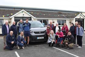 Tom and Dan Morrissey, Louis Quirke, Colm Barry, Tony Condon, Carol Condon, all of Ahane GAA Club, with residents of St Vincent’s, Lisnagry and their new minibus  | PICTURE: Dave Gaynor