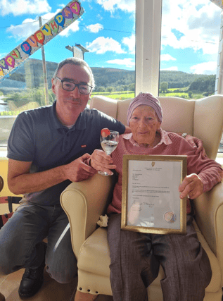 Mairead Hickey celebrating her 101st Birthday at St. Martha's Nursing Home, Bansha, with her son Liam.