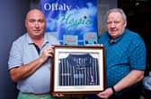Enda Mollen and Martin O' Connor, Faithful Golf Society members, with the Padraig Harrington Kartel Golf Shirt worn when he won the Volvo Championship in the US
