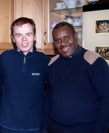 Tommy Barrett pictured with Fr Martin who wiill bring the masks back home to Tanzania