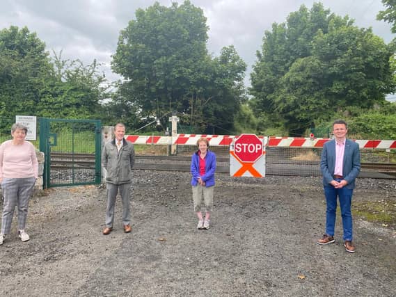 Betty Houlihan , Cllr Gerald Mitchell and Maureen Drake with Minister-of-State Patrick O’Donovan at the Fantstown level crossing near Kilmallock