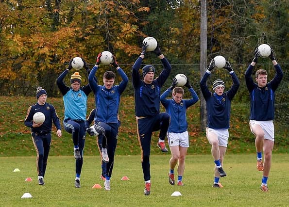 Tipperary players warm-up with the ball. (Pic: Seb Daly/Sportsfile)