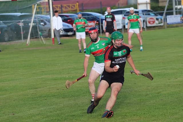 James O'Sullivan (Cashel King Cormacs) tires to get away from the attention of Brian Gavin (Solohead) when the sides met in the Tipperary Co-Op West Junior B Hurling Championship semi-final Photo: Fra