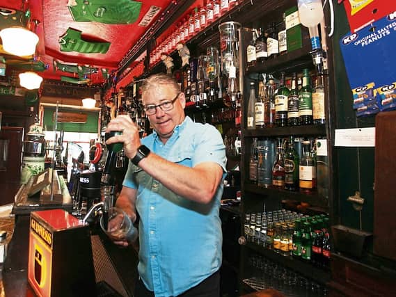 A pint of the black stuff: Padraig Power of Bradshaws in Castleconnell gears up for Monday PICTURE: BRENDAN GLEESON
