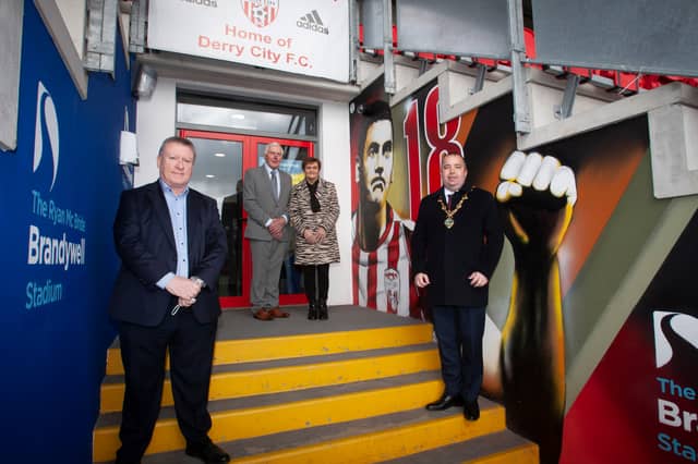 The Mayor of Derry City and Strabane District Council, Brian Tierney pictured with the late Mark Farren's parents Michael and Kathleen visiting their son's mural at the Ryan McBride Brandywell Stadium