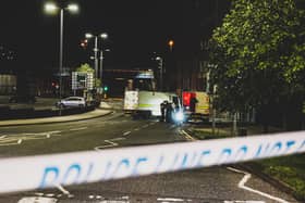 Police officers at the security alert at Craigavon Bridge last night. Photograph by Nathan Edgar