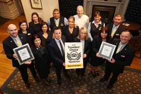 Staff at Bishop's Gate Hotel show off their awards.