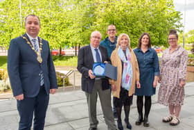 Paddy joined by his family as he receives a gift from the Mayor. Photo by Martin McKeown