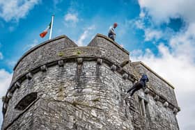 Eoin Barry, Askeaton, abseiling down the side of King John's Castle under the guidance of Dave Neville, Nevsail ahead of its re-opening next week