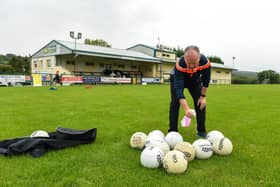 Paul Gallagher, team official, sanitising the footballs before a Glenswilly GAA Club training session last summer  Picture: Oliver McVeigh/Sportsfile