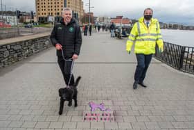 Mayor of Derry City and Strabane District Council, Councillor Brian Tierney, with Joe Gray and his poodle Luna, taking part in a walkabout along the quay. Photo by Martin McKeown.