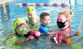 Darren Griffin with his mother Sarah O'Donovan , Hyde Road with Anna Newell and Muireann D'Arcy from the Anna Newell Theatre Adventures SING ME TO THE SEA event in the Hydro Pool at St Gabriel Centre