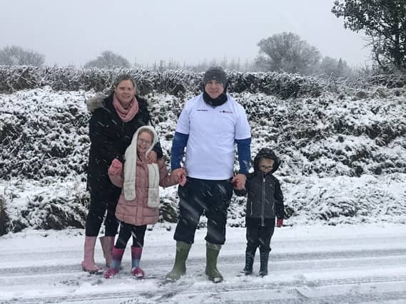 The Brennan family ellow road, Castlecomer doing their virtual wellie race on a very snowy New years Evee