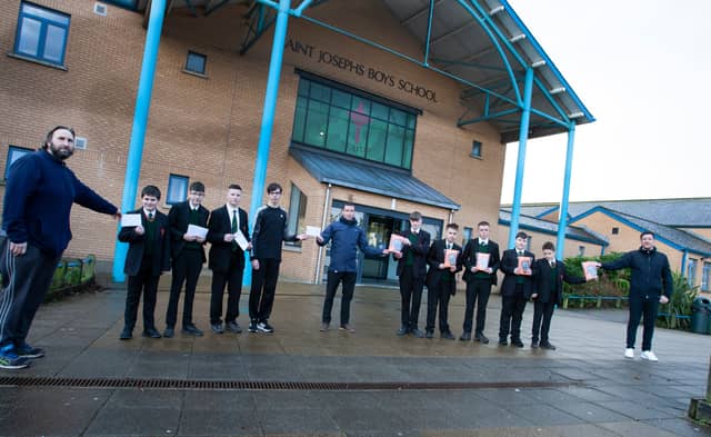 The St Joseph's pupils receive their vouchers and tablets. Photo by Jim McCafferty