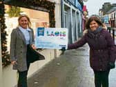 Laois Chamber's Vice President Alison Browne and CEO  Bernie Everard brave the elements to urge you go use the Loais Gift Card