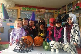 Spooky goings on in Castleconnell National School: Junior infants teacher Grainne Greene with her pupils and homegrown pumpkins