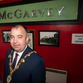 Jordan McGarvey gives the Mayor a trim this morning. (Photo: Jim McCafferty Photography)