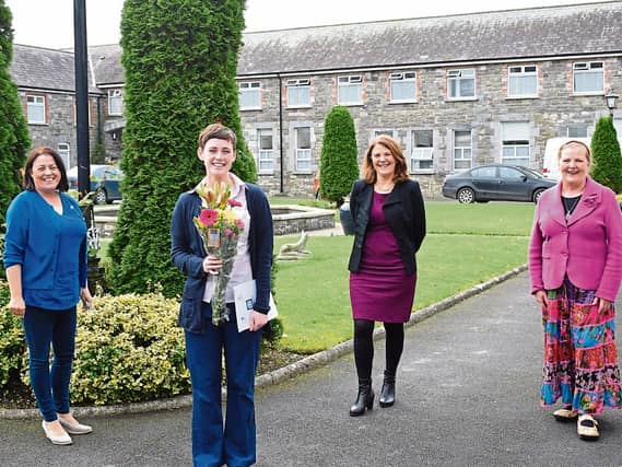 Sinead Dwyer,3rd year student nurse, is welcomed to Bruree House by Bernie Curtin, Mary Owens & Peig Ryan