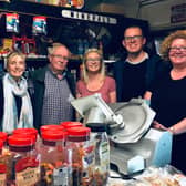 Paddy Gill and his wife Marian with their five children in the shop which closed today.