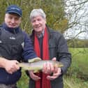 Lionel Knobbs of the Loughs Agency introduces Joe Mahon to one of his catches on the Foyle.