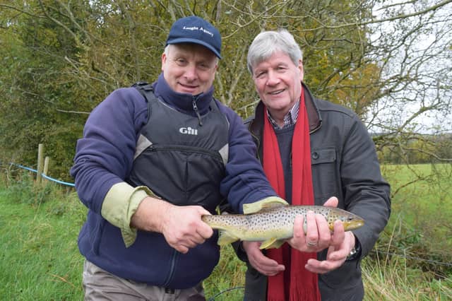 Lionel Knobbs of the Loughs Agency introduces Joe Mahon to one of his catches on the Foyle.