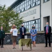 Staff and students at St Cecilia's College receive their award.
