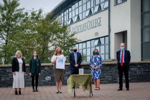 Staff and students at St Cecilia's College receive their award.