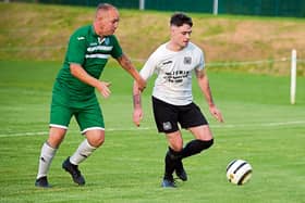 Conor Lonergan feels the presence of Clonmel Celtic’s Shane Butler in the Tipperary Cup semi-final in Clonmel
