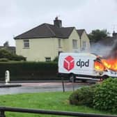 One of the vehicles on fire in Creggan.