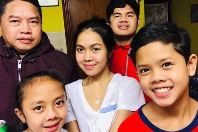 Miguel is pictured with family members Mikee, Michael, John and Chekie