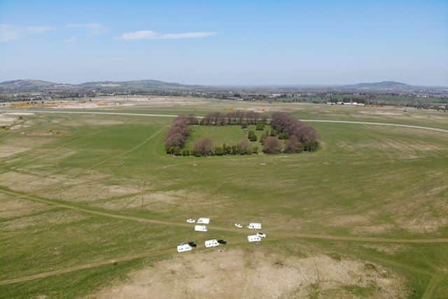 Another smaller encampment of up to six caravans and vehicles was located near the intercity rail line (below).