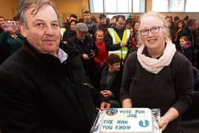 Margaret O’Brien presents Cllr Joe Hannigan with a specially made cake to symbolise local support for his campaign