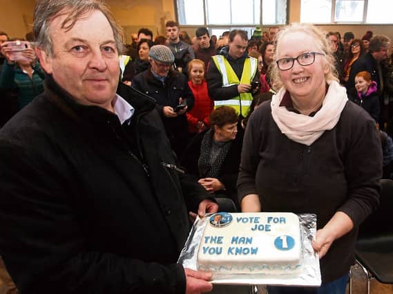 Margaret O’Brien presents Cllr Joe Hannigan with a specially made cake to symbolise local support for his campaign