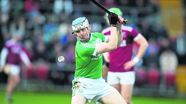 TJ Reid takes a free for Ballyhale against tough competitors Slaughtneil Picture: John McIlwaine