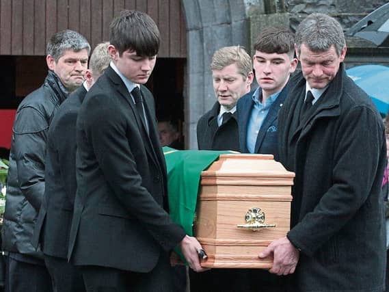 Sad farewell: The Ahane GAA flag was draped over Willie Keane’s coffin as he went to his eternal reward after a life well-lived - PICTURE: Dave Gaynor