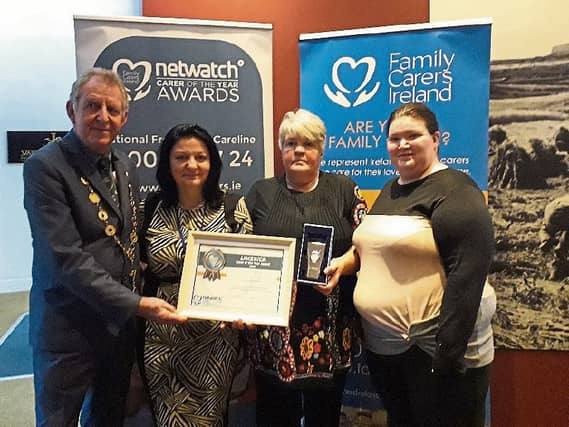 Mayor Michael Sheahan withJean Ryan, National Carers Organisation presenting Frances O’Donoghue with her award. Also present is Frances' daughter Michelle who nominated her