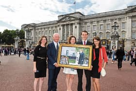 Artist Michael Hanrahan outside Buckingham Palace with daughters Sinead Aisling, Orla and son Daniel