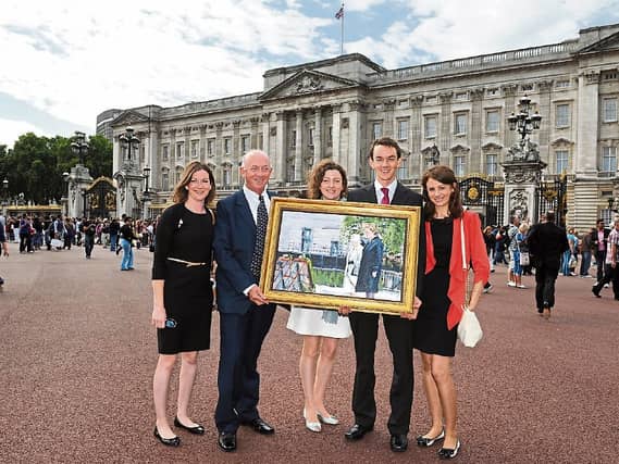 Artist Michael Hanrahan outside Buckingham Palace with daughters Sinead Aisling, Orla and son Daniel