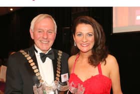 Deirdre McGlone presented with the Donegal person of the Year trophy by Hugh Harkin
