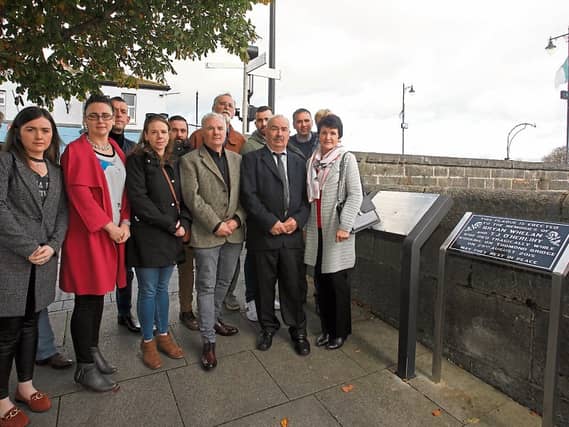 Family members of the deceased men and public representatives at the plaque in honour of Bryan Whelan and TJ O'Herlihy PICTURE: Brendan Gleeson