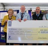 Dovea Genetics prestenting a cheque for €19,879 to Embrace FARM during the 2019 Ploughing Championships