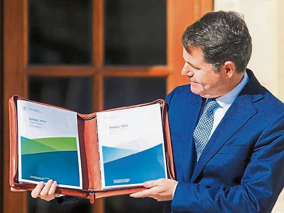 Finance Minister Pascal Donohoe proudly displaying his work