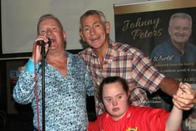 Johnny Peters belting out "You'll never walk alone" with Pat on stage  at McDonnells last Friday night, assisted by Pat's GAA buddy, Jennifer Malone.